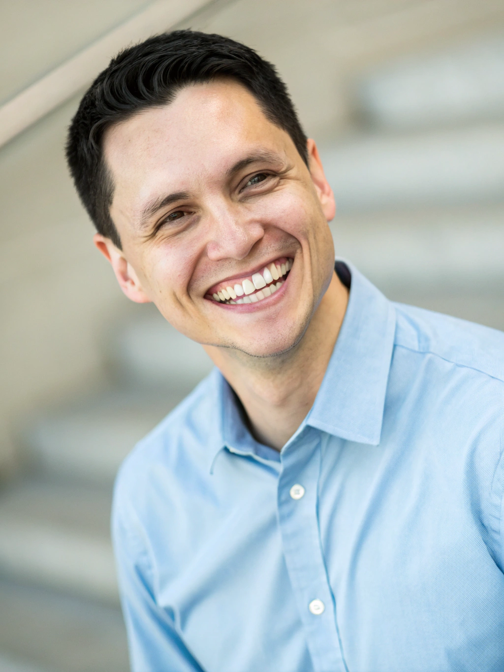 David Kim, Canadian IELTS instructor pointing forward with warm confidence